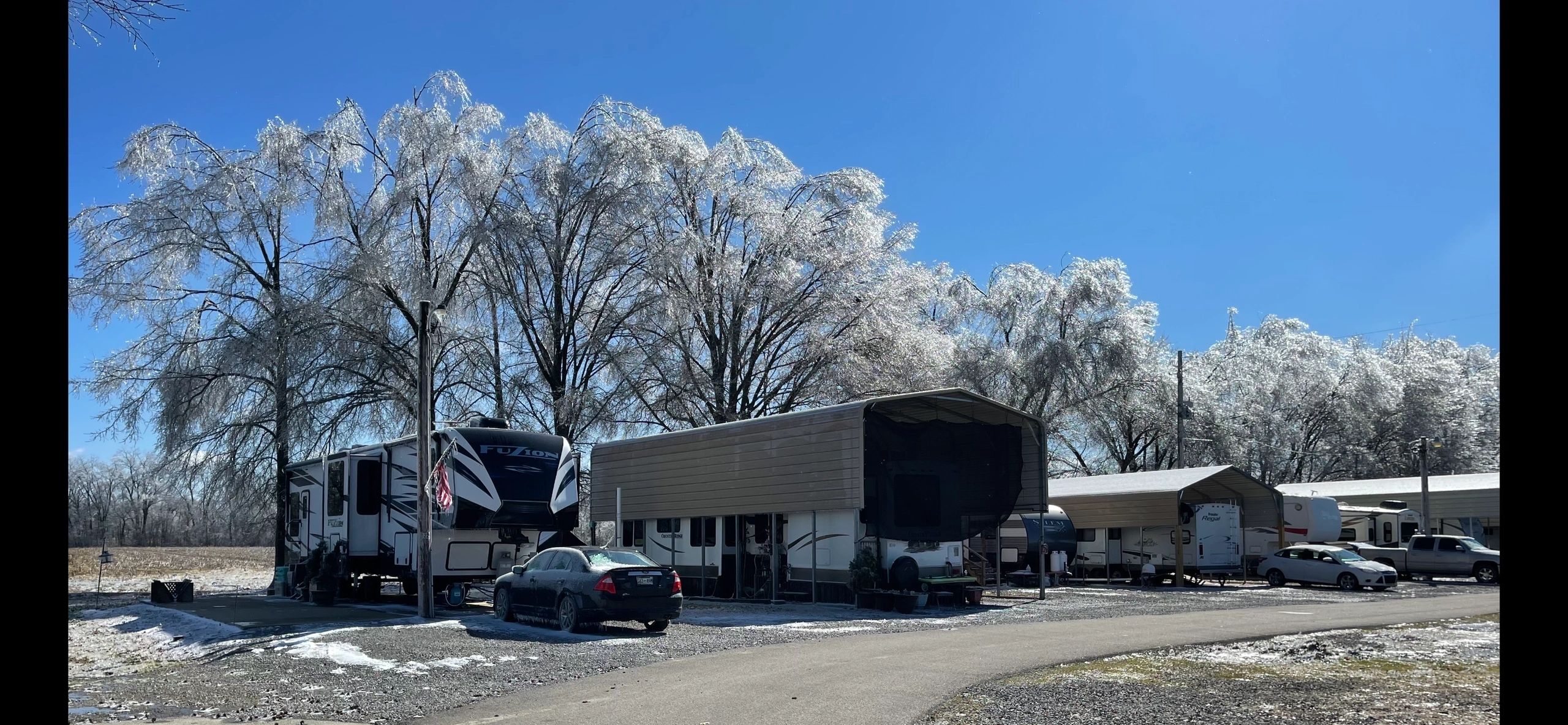 Covered RV sites and paved drives at Casper Creek